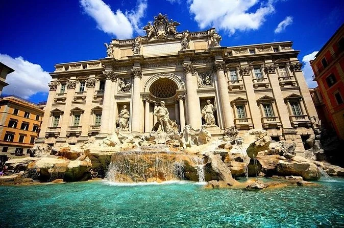 The Trevi Fountain in bright sunshine with turquoise water